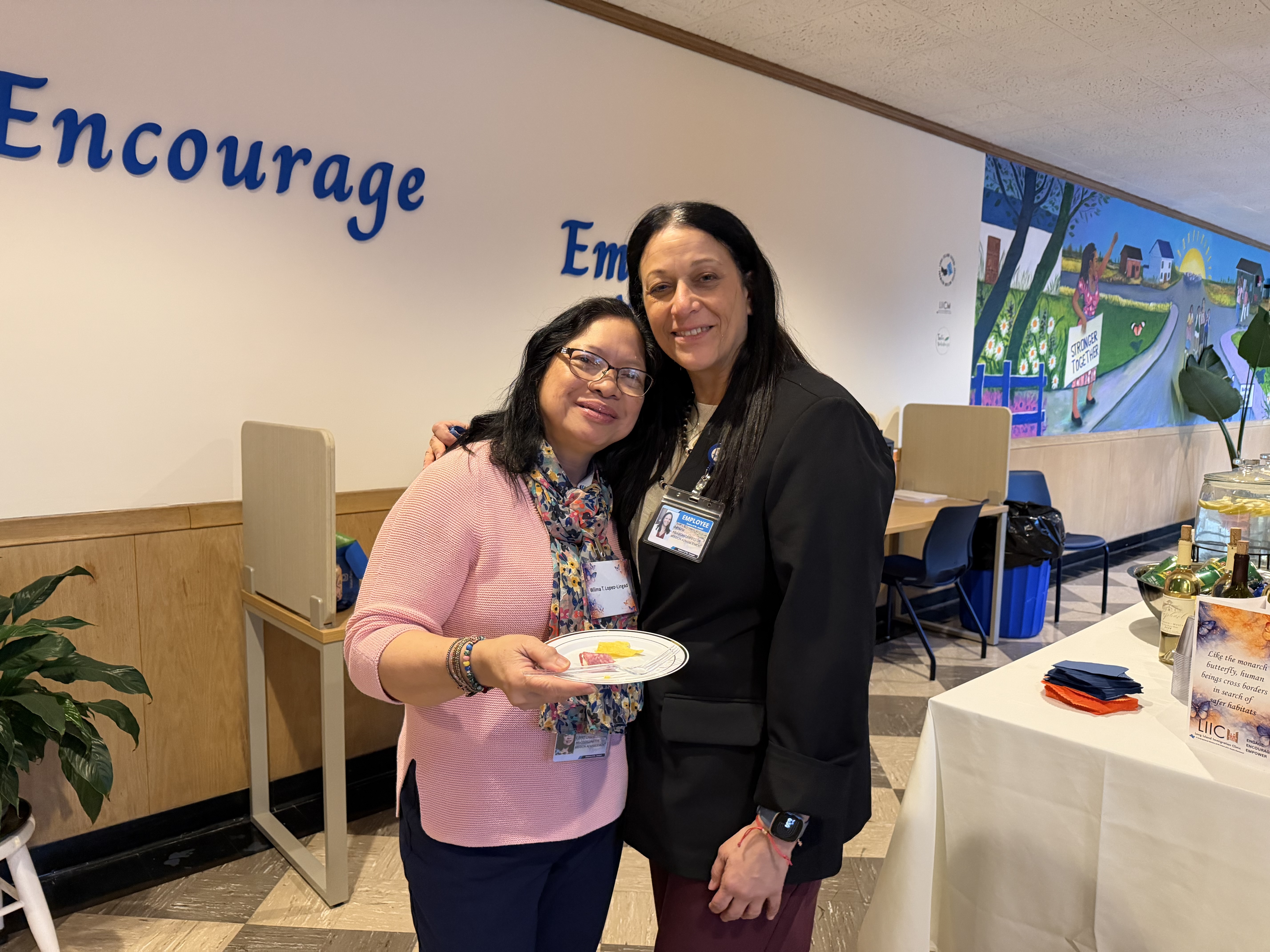 Employees embracing.